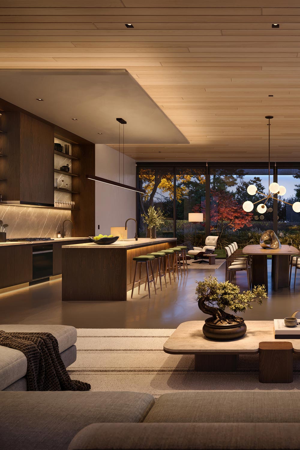 Modern open kitchen and living area with warm interior lighting