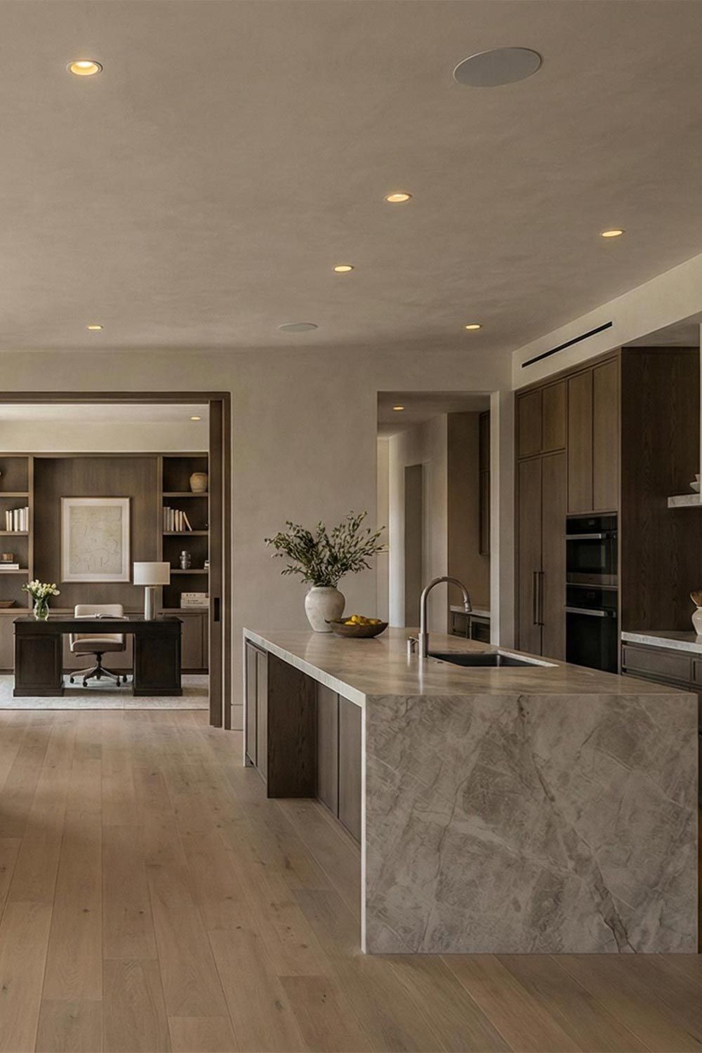 Open concept kitchen and home office with recessed ceiling speakers