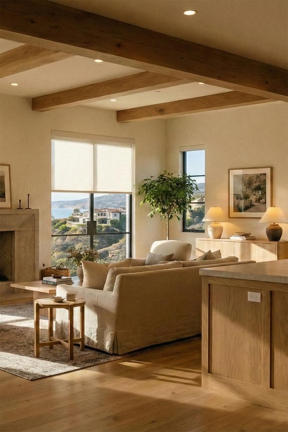 Bright living room with automated window shades and exposed wood beams