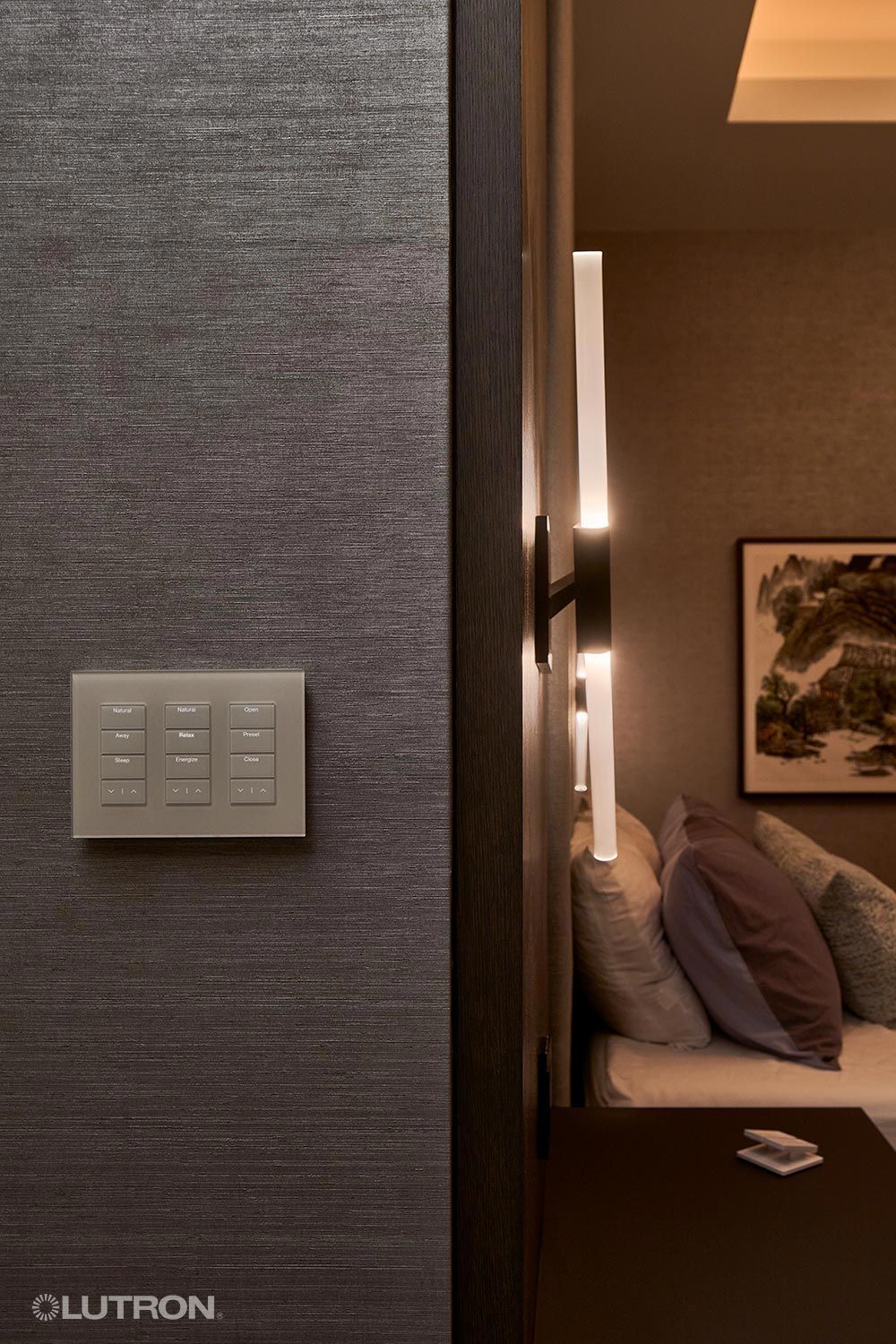 Smart lighting control panel in a cozy bedroom setting