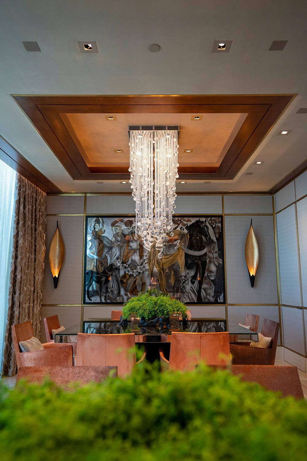 Elegant dining room with chandelier and ceiling speakers
